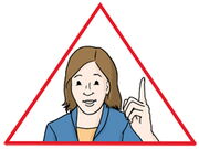 Frau in einem dreieckigen Achtung-Schild
