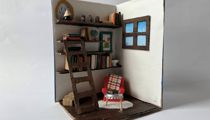 Aus Pappe gebasteltes Book Nook Leseecke