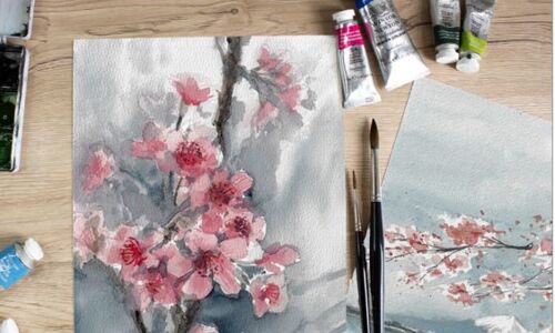 Pinsel, Farben und gemaltes Aquarellbild auf dem Kirschblüten zu sehen sind