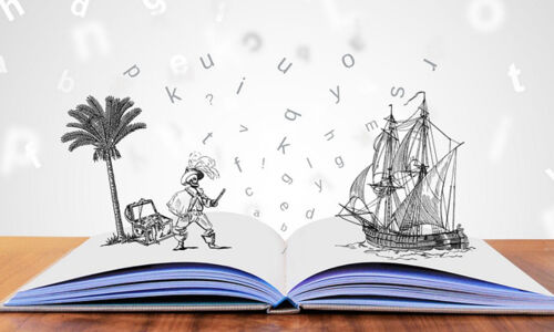Buch auf Tisch mit visuellen Buchstaben und Illustrationen