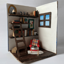 Aus Pappe gebasteltes Book Nook Leseecke