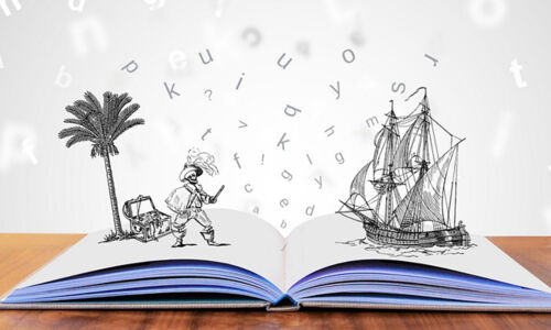 Buch auf Tisch mit visuellen Buchstaben und Illustrationen